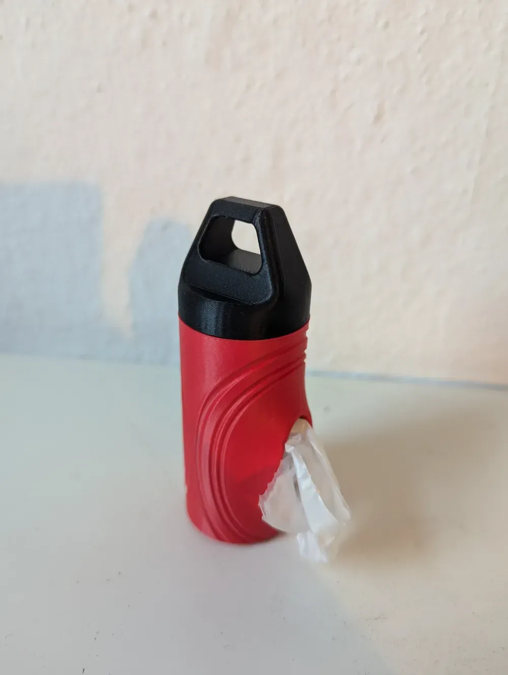 Dispenser de saquinho com alça